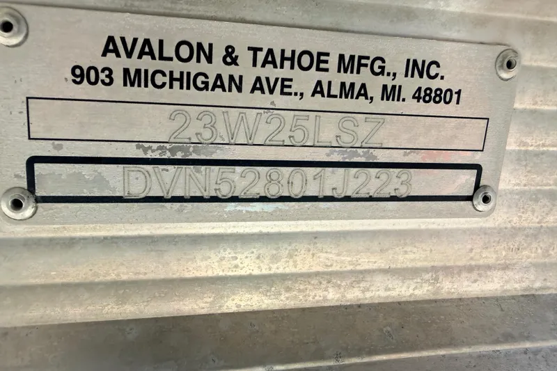 Slide: The Image of Metal plate with Avalon & Tahoe MFG details, featuring model and serial numbers. - 18