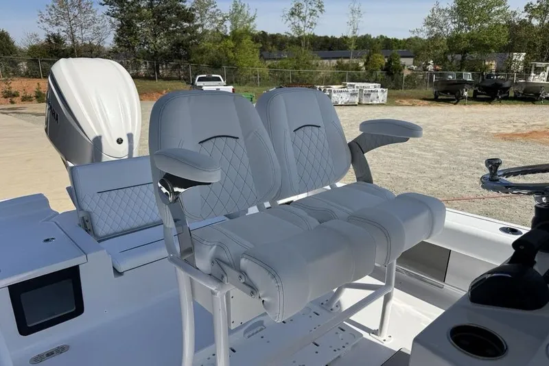 Slide: The Image of 2026 Sportsman Masters 247OE Bay Boat with dual seating and modern helm design. - 13