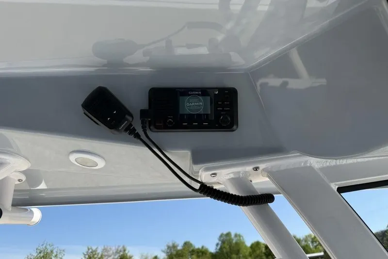 Slide: The Image of Garmin marine radio installed on 2026 Sportsman Masters 247OE Bay Boat console. - 14
