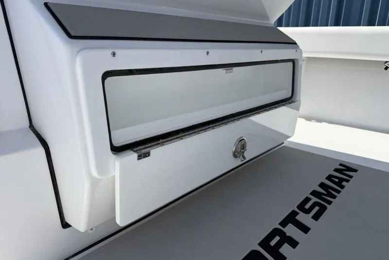 Slide: The Image of 2026 Sportsman Masters 247OE Bay Boat storage compartment, featuring sleek design and secure latch. - 20
