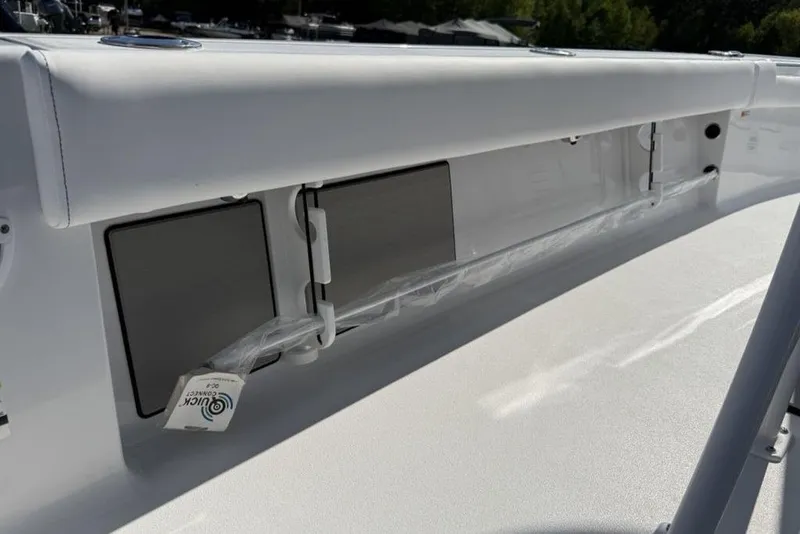 Slide: The Image of 2026 Sportsman Masters 247OE Bay Boat interior detail with storage compartments. - 25