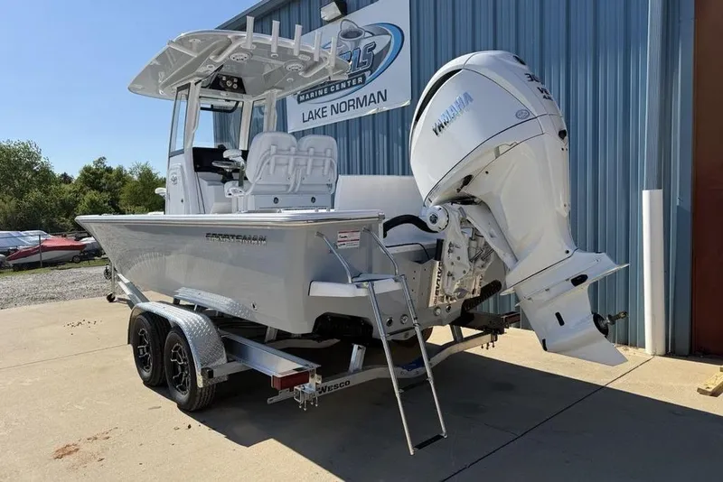 Slide: The Image of 2026 Sportsman Masters 247OE Bay Boat with Yamaha engine on trailer at marine center. - 3