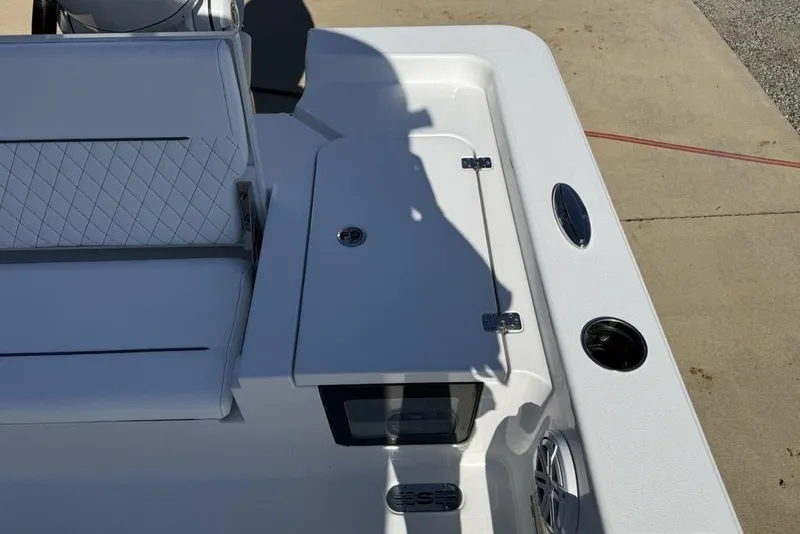 Slide: The Image of 2026 Sportsman Masters 247OE Bay Boat deck with storage compartment and seating. - 30