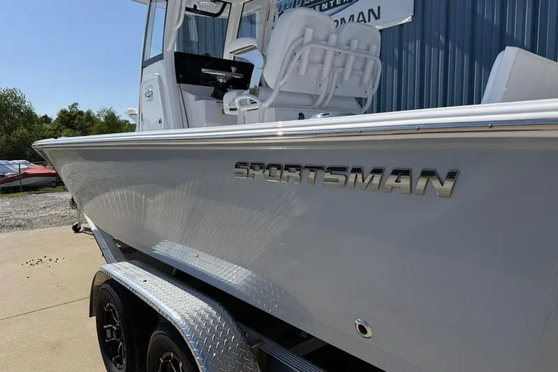 Slide: The Image of 2026 Sportsman Masters 247OE Bay Boat on trailer, showcasing sleek design and modern features. - 4