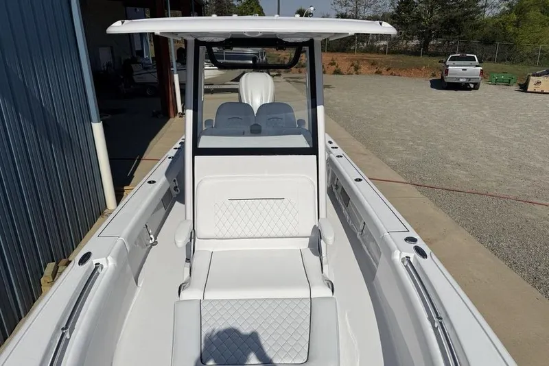 Slide: The Image of 2026 Sportsman Masters 247OE Bay Boat, showcasing sleek design and spacious seating. - 5