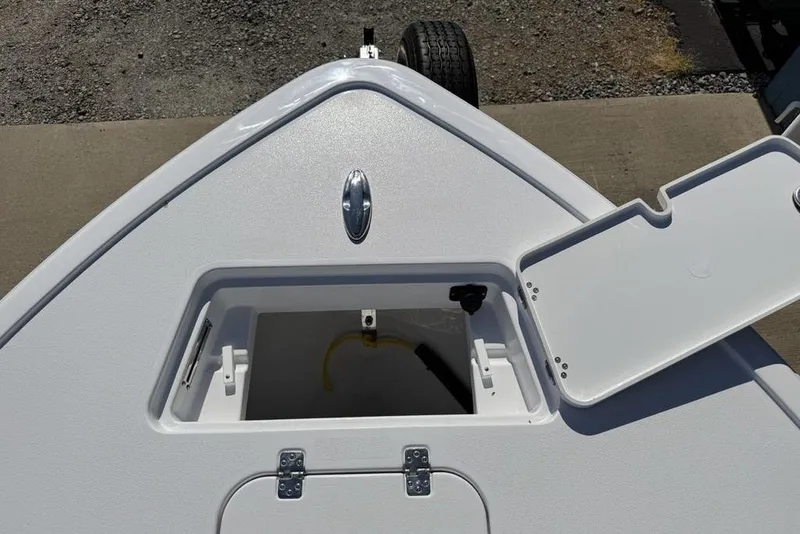 Slide: The Image of Bow storage compartment of 2026 Sportsman Masters 247OE Bay Boat, open lid view. - 6