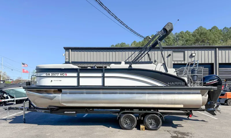 The Image of 2025 Harris Cruiser 210 SL pontoon boat on trailer. - 1