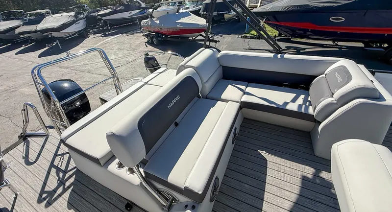 Slide: The Image of 2025 Harris Cruiser 210 SL pontoon boat with luxurious seating area. - 20