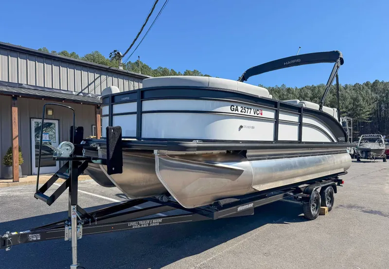 Slide: The Image of 2025 Harris Cruiser 210 SL pontoon boat on trailer. - 3