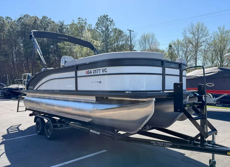 Slide: The Image of 2025 Harris Cruiser 210 SL pontoon boat on trailer outdoors. - 5