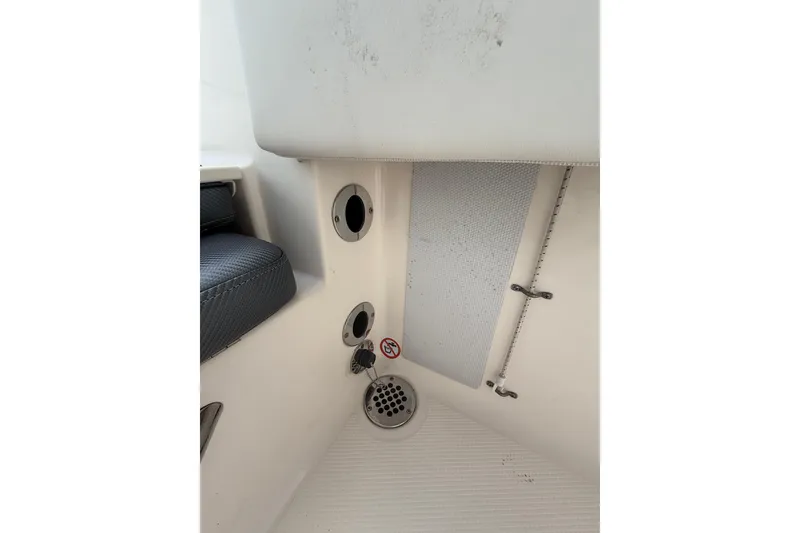 Slide: The Image of 2021 Robalo R180 Center Console interior detail with drainage and seating. - 13