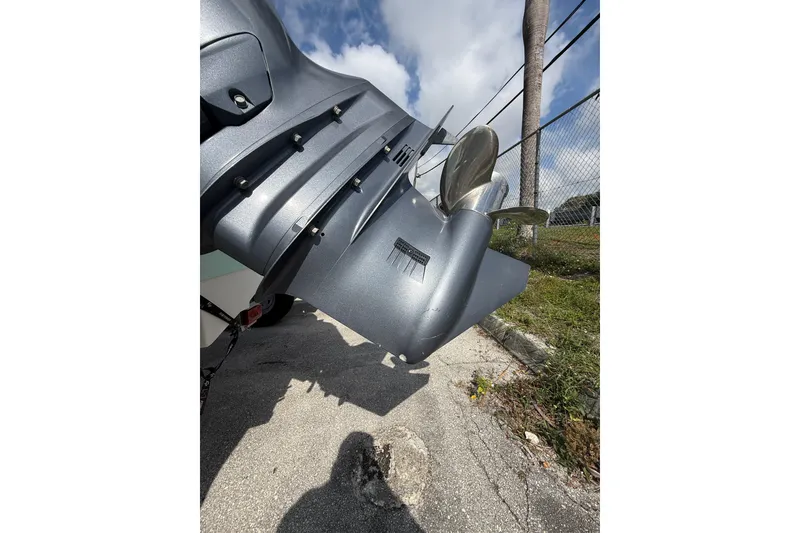 Slide: The Image of 2021 Robalo R180 Center Console boat engine and propeller close-up. - 21