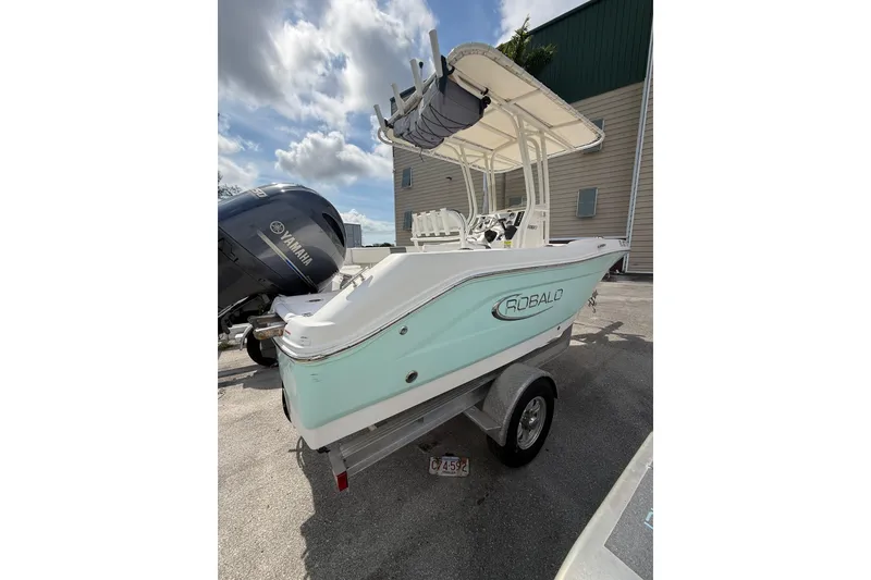 Slide: The Image of 2021 Robalo R180 Center Console boat with Yamaha engine, parked on a trailer. - 25