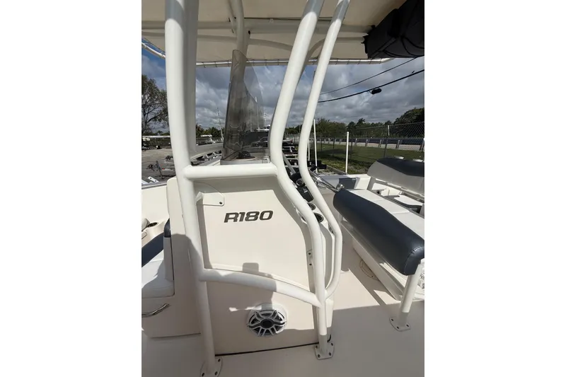 Slide: The Image of 2021 Robalo R180 Center Console boat interior with seating and console details. - 27