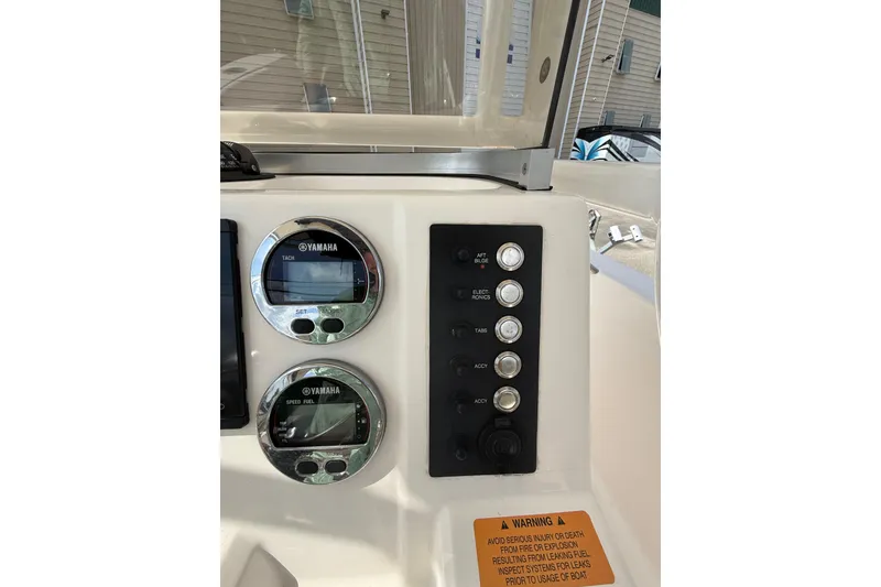 Slide: The Image of 2021 Robalo R180 Center Console dashboard with Yamaha gauges and control panel. - 3