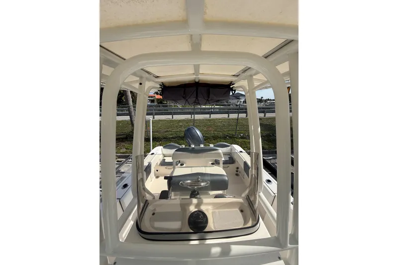 Slide: The Image of 2021 Robalo R180 Center Console boat interior with steering wheel and seating. - 9
