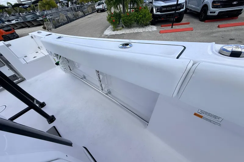 Slide: The Image of 2025 Sportsman Open 232 Center Console boat interior with storage compartments. - 10