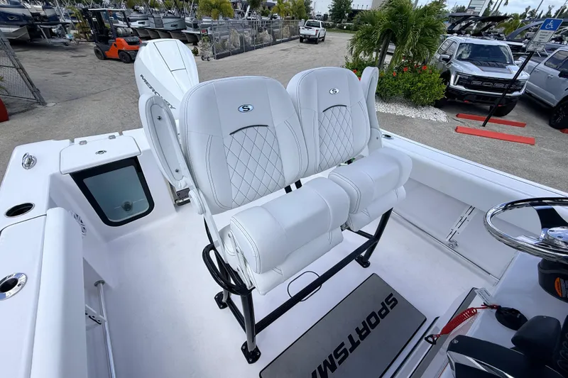 Slide: The Image of 2025 Sportsman Open 232 Center Console boat with white seating and modern design. - 12