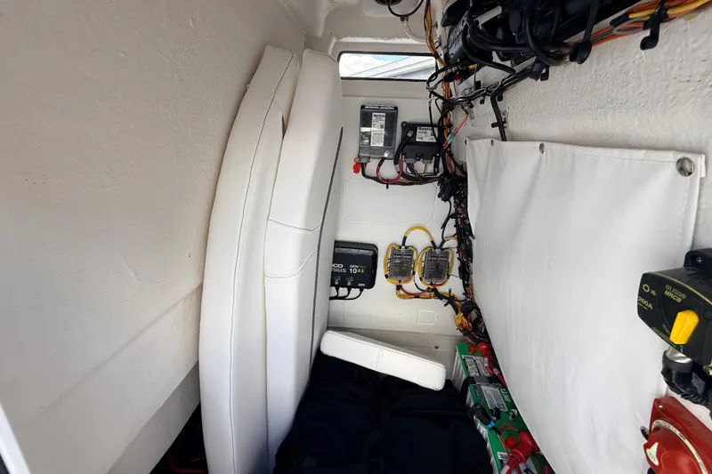 Slide: The Image of Interior view of 2025 Sportsman Open 232 Center Console boat's electrical wiring and components. - 17