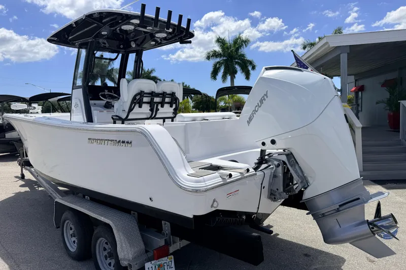 Slide: The Image of 2025 Sportsman Open 232 Center Console boat with Mercury engine on trailer. - 3