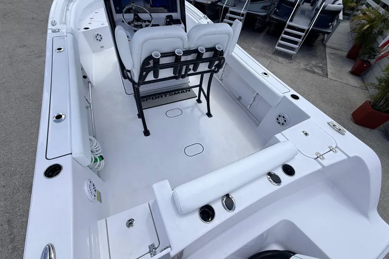 Slide: The Image of 2025 Sportsman Open 232 Center Console boat interior with seating and console view. - 5