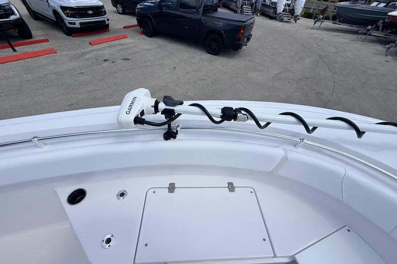 Slide: The Image of 2025 Sportsman Open 232 Center Console boat with Garmin equipment in a parking lot. - 8