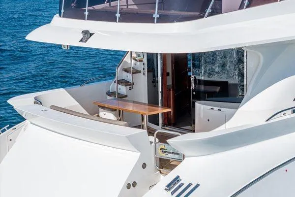 Slide: The Image of 2023 Massimo Marine Sunbird yacht with elegant deck and modern design on the water. - 10