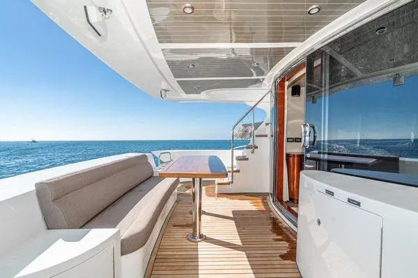 Slide: The Image of Luxurious 2023 Massimo Marine Sunbird yacht deck with seating and ocean view. - 12