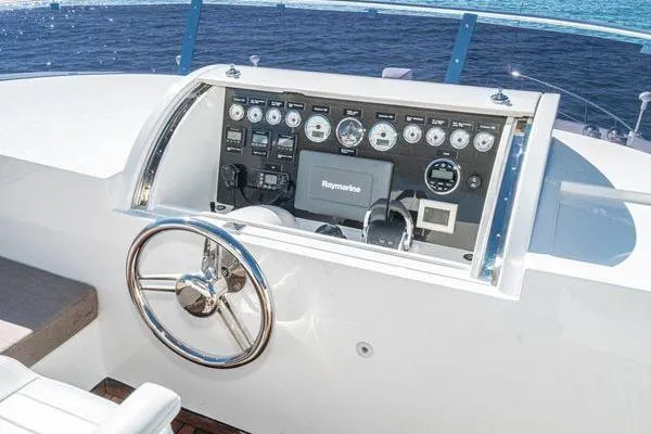 Slide: The Image of 2023 Massimo Marine Sunbird dashboard with steering wheel and navigation controls. - 21