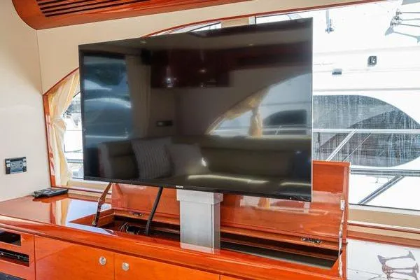 Slide: The Image of Luxury yacht interior with a large TV, Massimo Marine Sunbird 2023 model. - 27