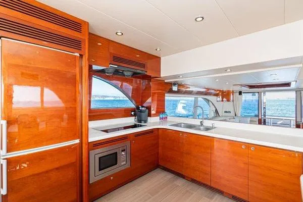 Slide: The Image of Luxurious 2023 Massimo Marine Sunbird yacht kitchen with modern appliances and ocean view. - 29