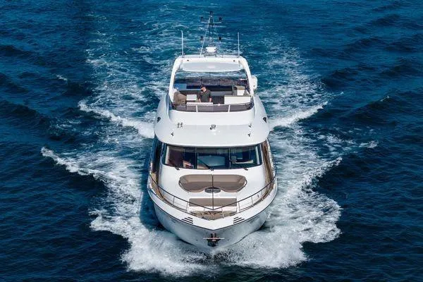 Slide: The Image of Luxurious 2023 Massimo Marine Sunbird yacht cruising on open water. - 3