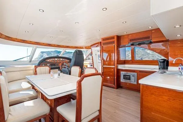 Slide: The Image of Luxurious 2023 Massimo Marine Sunbird yacht interior with dining area and modern kitchen. - 30