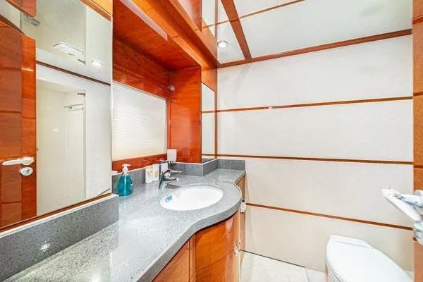 Slide: The Image of Luxurious bathroom in 2023 Massimo Marine Sunbird yacht with modern fixtures and elegant wood accents. - 40