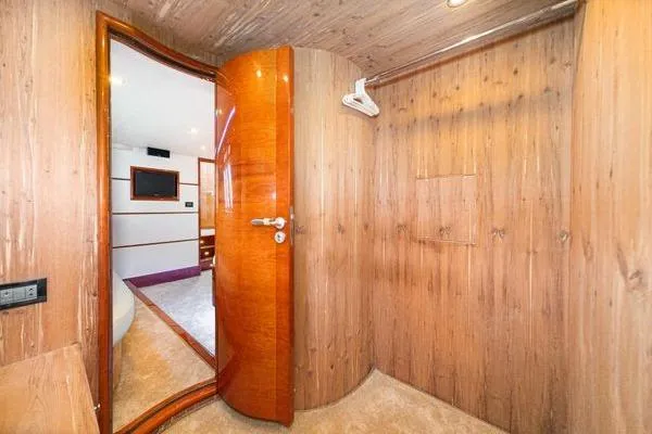 Slide: The Image of Interior of 2023 Massimo Marine Sunbird yacht with wooden walls and open door. - 42