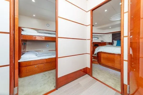 Slide: The Image of Luxurious 2023 Massimo Marine Sunbird yacht interior with cozy bedrooms and elegant wood finishes. - 43