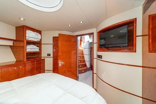 Slide: The Image of Luxurious 2023 Massimo Marine Sunbird yacht cabin with wood finishes and modern amenities. - 45