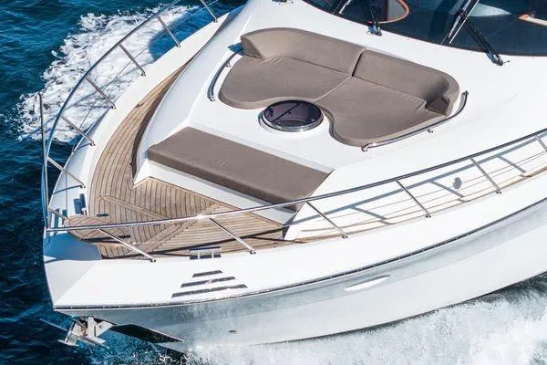 Slide: The Image of 2023 Massimo Marine Sunbird yacht cruising on blue ocean waters. - 8
