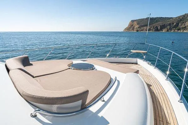 Slide: The Image of Luxurious 2023 Massimo Marine Sunbird yacht deck with ocean view and sun loungers. - 9