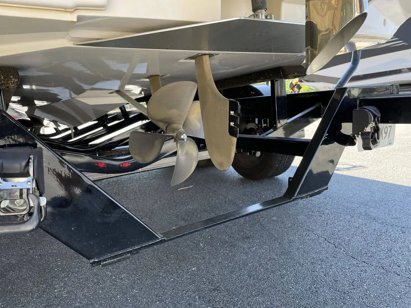 Slide: The Image of Underside of a 2015 Nautique G25 boat with propeller. - 19