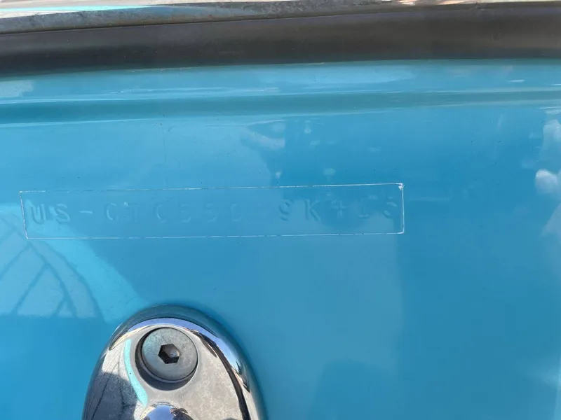 Slide: The Image of Serial number on blue Nautique G25 boat hull, year 2015. - 25