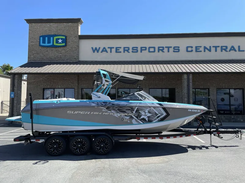 Slide: The Image of 2015 Nautique G25 boat parked in front of Watersports Central. - 3