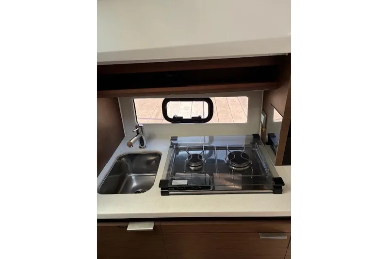 Slide: The Image of Compact kitchen area in 2022 Jeanneau Leader 10.5 WA Series 2 boat. - 12