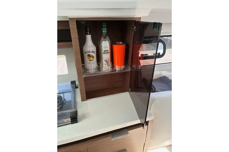 Slide: The Image of 2022 Jeanneau Leader 10.5 WA Series 2 yacht interior with liquor cabinet and glass door. - 14