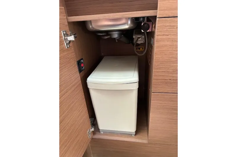 Slide: The Image of Cabinet with trash bin inside Jeanneau Leader 10.5 WA Series 2, 2022 model. - 16