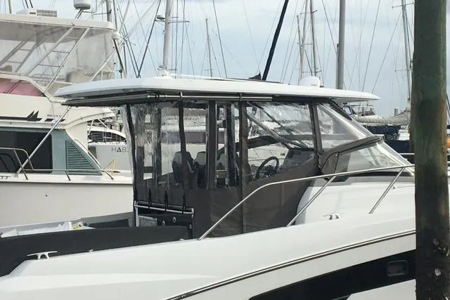 Slide: The Image of 2022 Jeanneau Leader 10.5 WA Series 2 docked at a marina. - 23