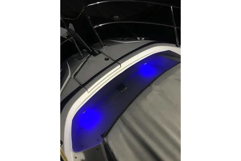 Slide: The Image of 2022 Jeanneau Leader 10.5 WA Series 2 boat with blue LED lighting. - 26