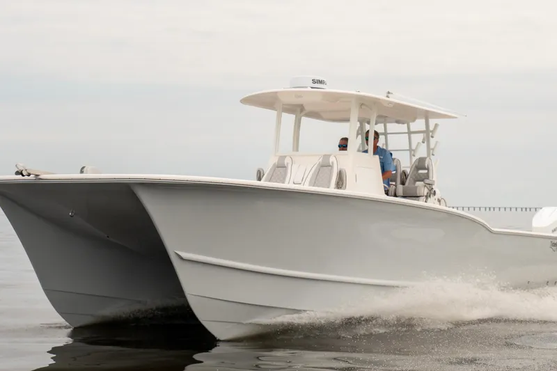 Slide: The Image of 2026 Tideline 365 Offshore boat cruising on calm waters. - 11