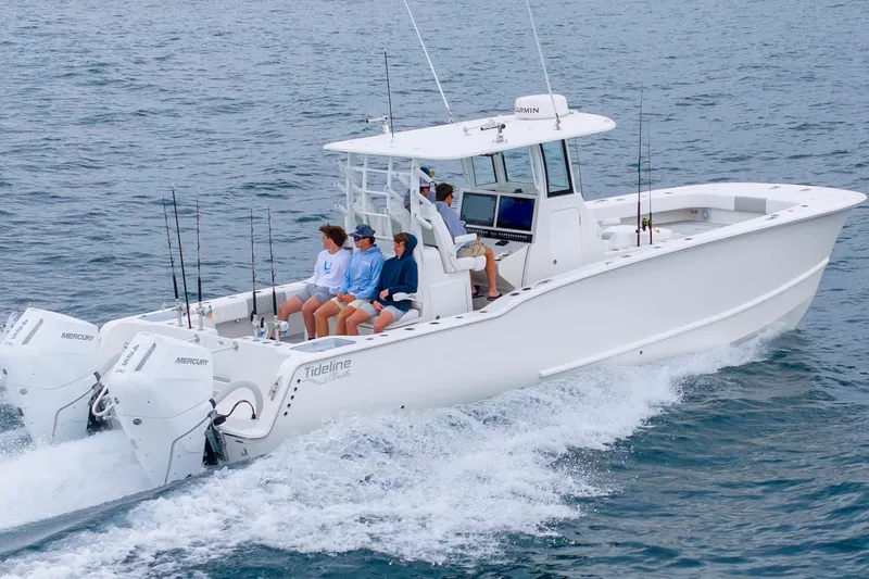 Slide: The Image of 2026 Tideline 365 Offshore boat cruising with passengers on open water. - 25