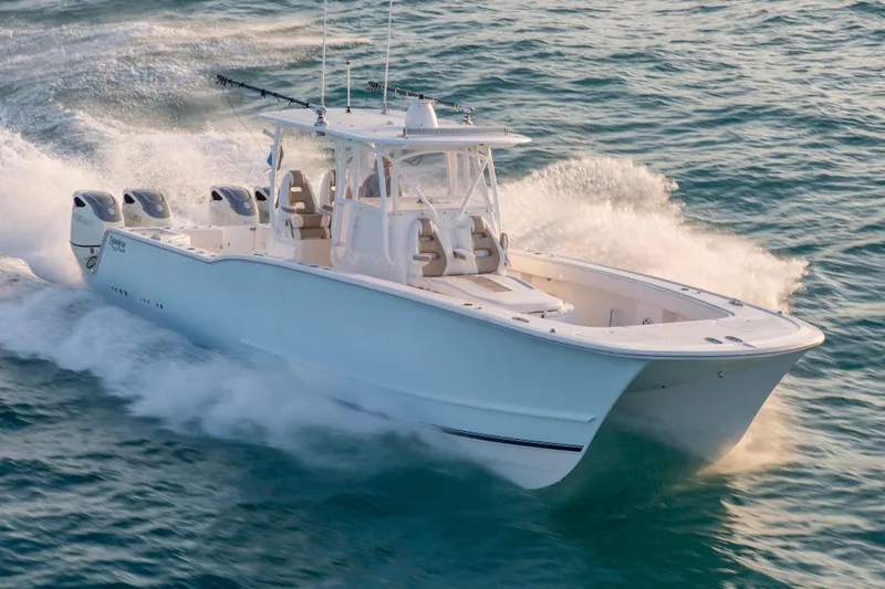 Slide: The Image of 2026 Tideline 365 Offshore boat cruising on open water, showcasing sleek design and powerful engines. - 28